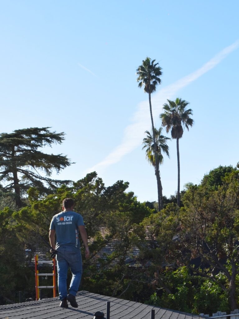 Solar Discovery - solar installer on roof in Los Angeles